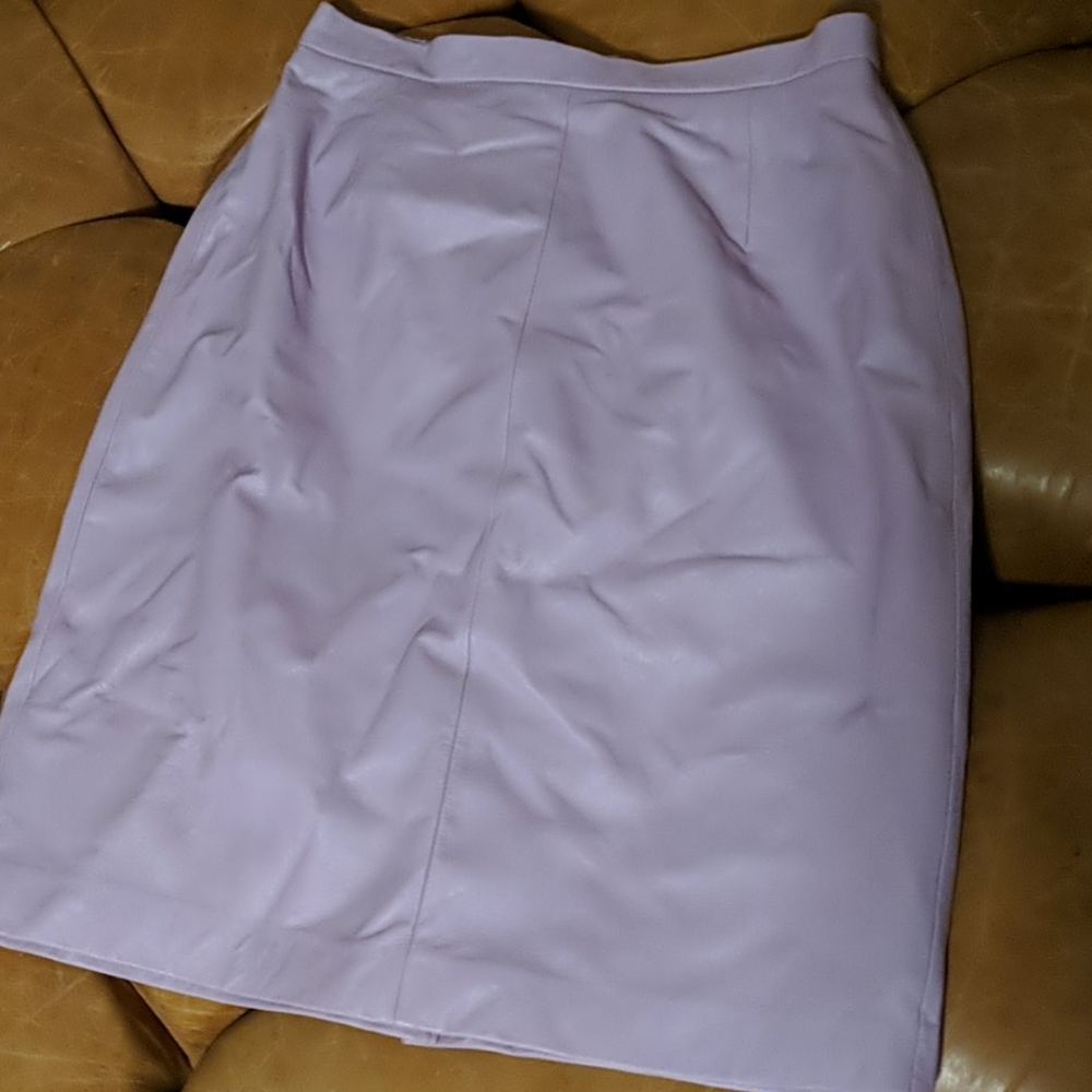 Lavender, knee-length leather skirt.